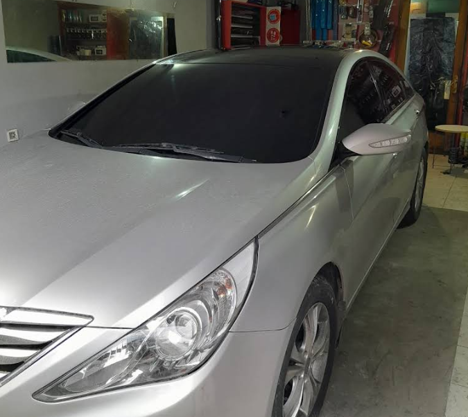 Silver Hyundai Sonata with tinted front windscreen